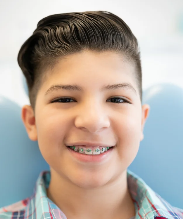 oung patient smiling with braces during airway-focused orthodontic care at Pittsford Orthodontics & Pediatric Dentistry in Pittsford, NY